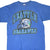 Front of blue Seattle Seahawks T-shirt with team name and football helmet graphic