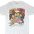 Front of white Packers vs. Patriots Super Bowl XXXI T-shirt with illustrated players and helmets
