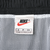 Nike size small label inside black swim trunks with white mesh lining