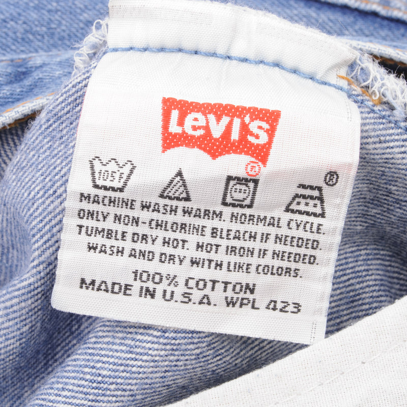 Beautiful Indigo Levis 501 Jeans 1990s Made in USA with Medium Light Wash With Light Whiskers   Size on tag 34X30   Back Button #511