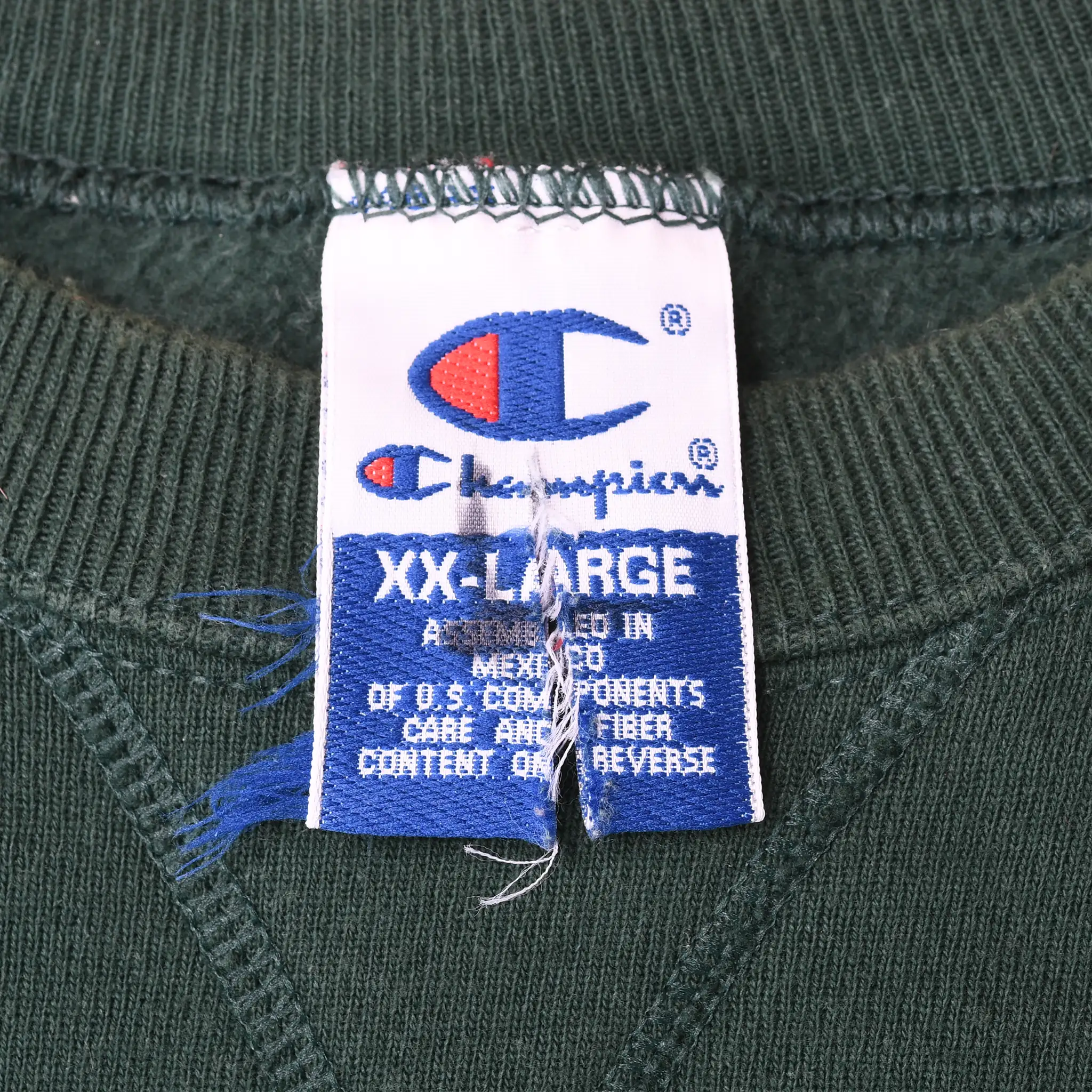 Champion XX-Large neck tag inside dark green sweatshirt