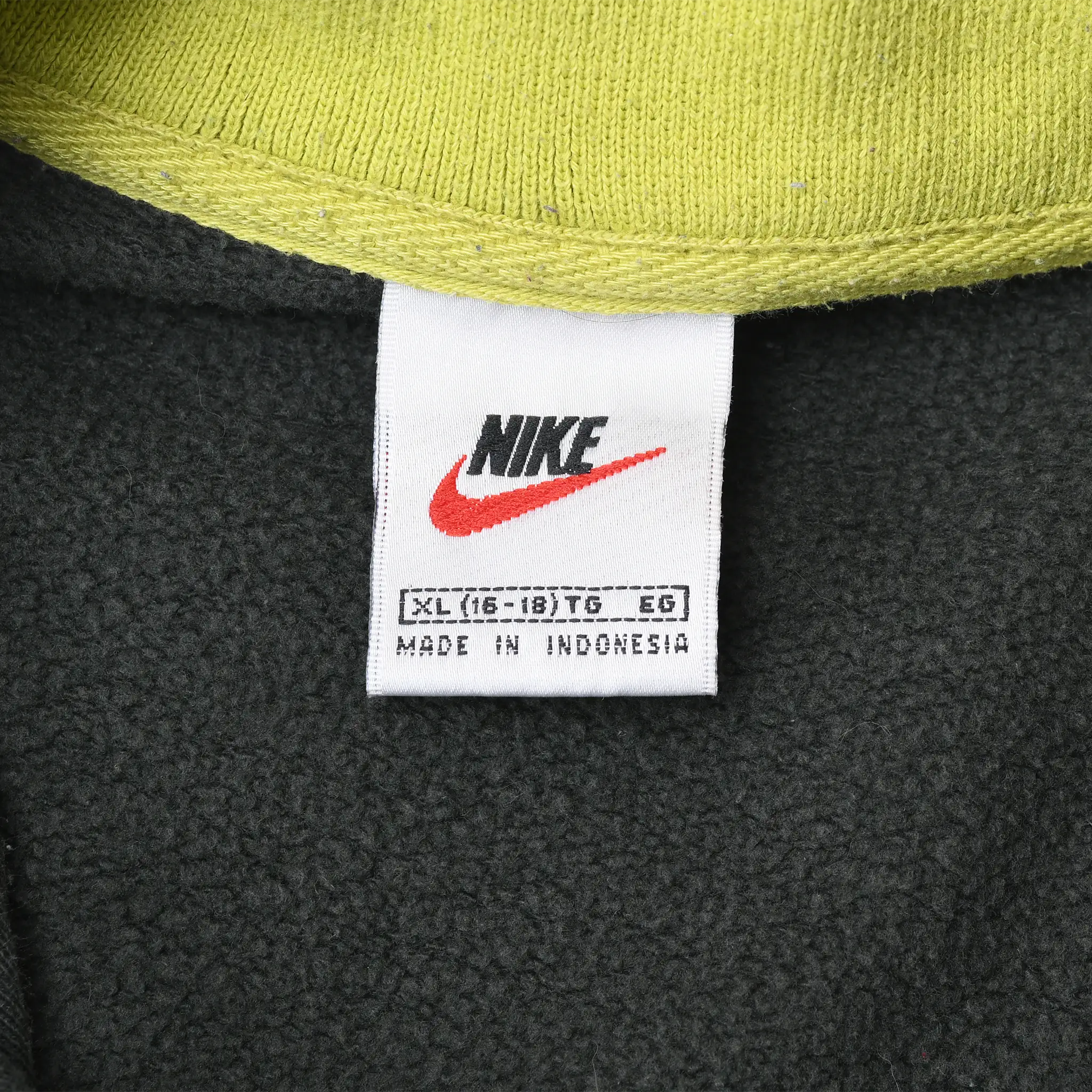 Nike neck tag marked XL (16–18) to EG and Made in Indonesia