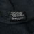 Black Holoubek care label with washing instructions inside Harley-Davidson hoodie