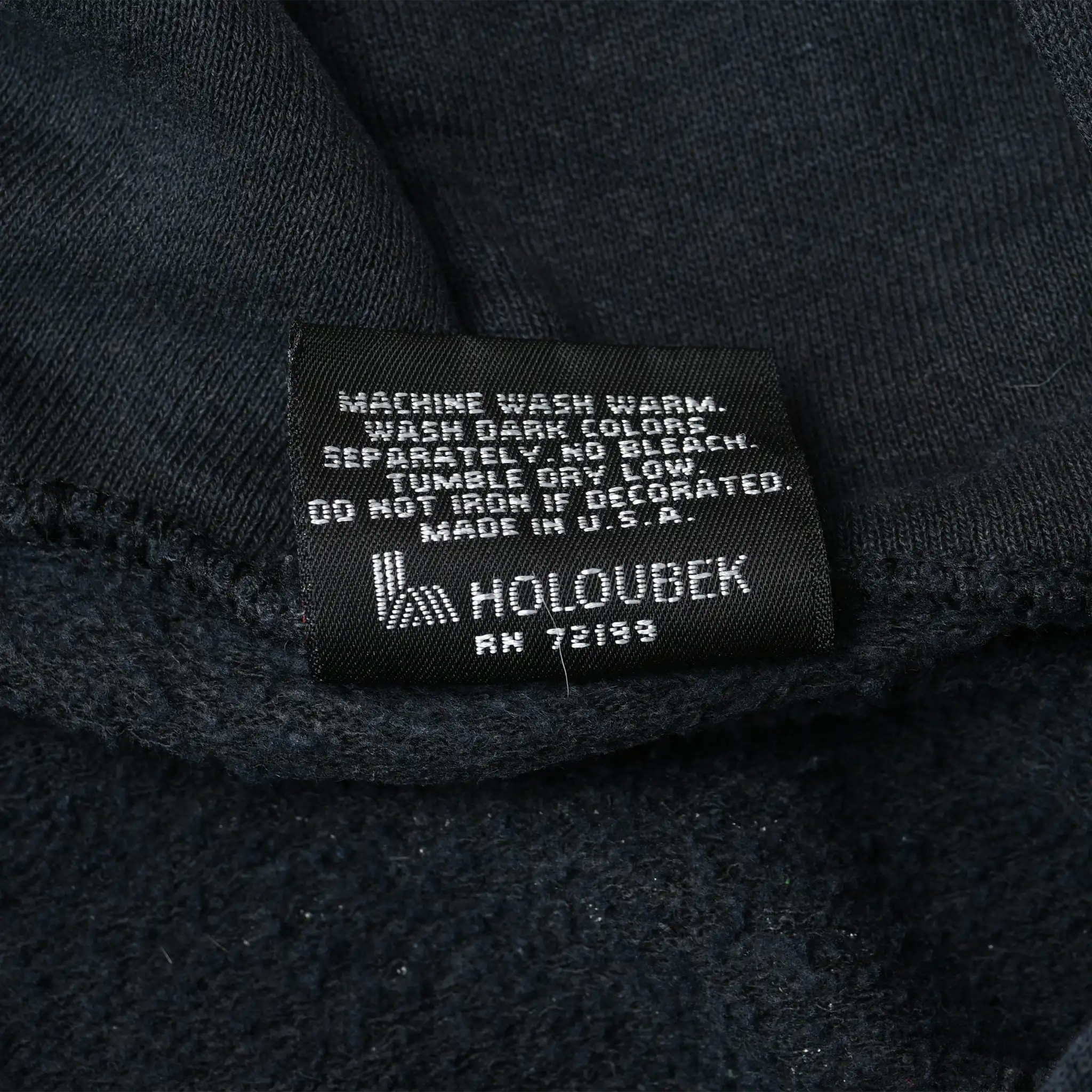 Black Holoubek care label with washing instructions inside Harley-Davidson hoodie