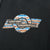Blue, orange and white Harley-Davidson chest logo print on black fabric