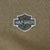 Close-up of Harley-Davidson Motor Cycles shield embroidery on khaki green hoodie chest