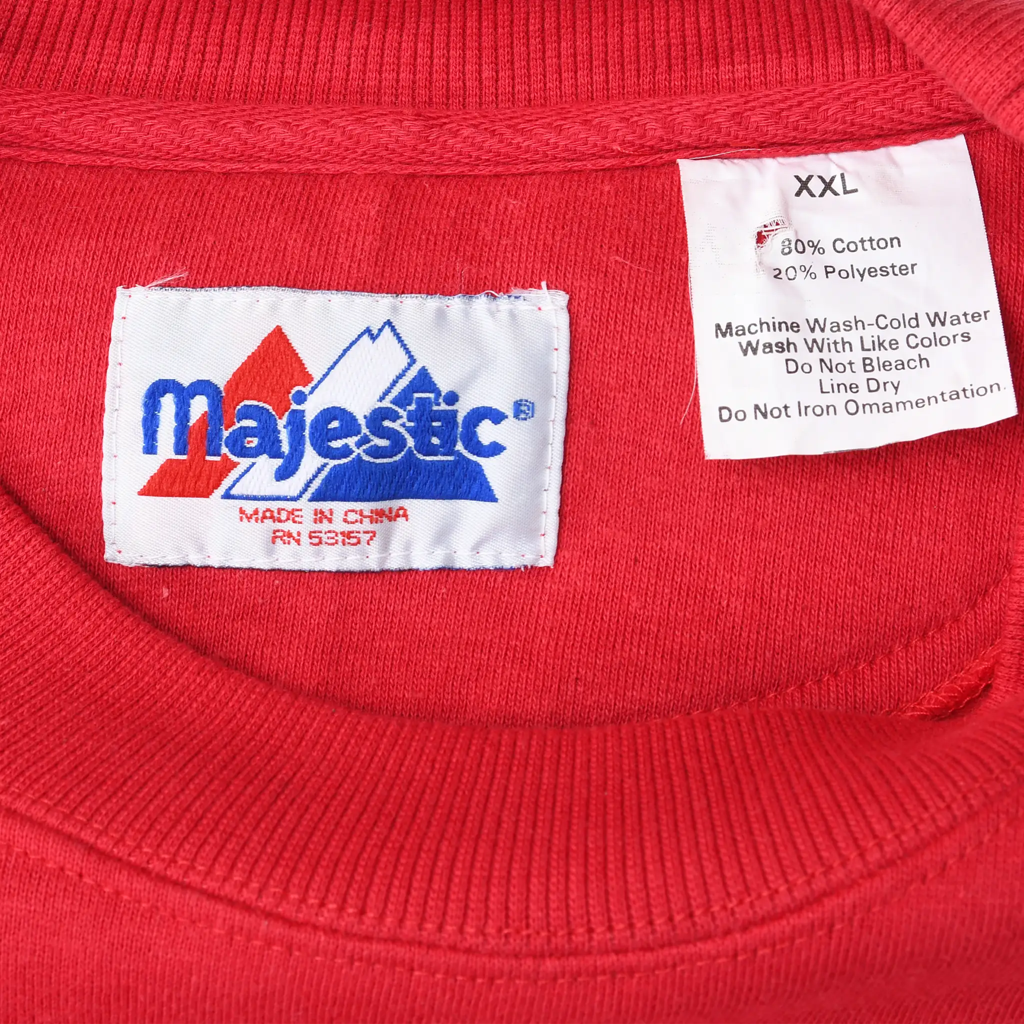 Majestic neck label and XXL care tag inside red Kansas City Chiefs sweatshirt