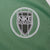 Close-up of black and white Nike Athletics crest embroidery on green jacket chest