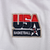 Close-up of red, navy and gold USA Basketball embroidered chest patch