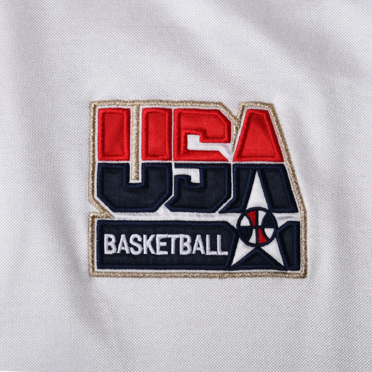 Close-up of red, navy and gold USA Basketball embroidered chest patch