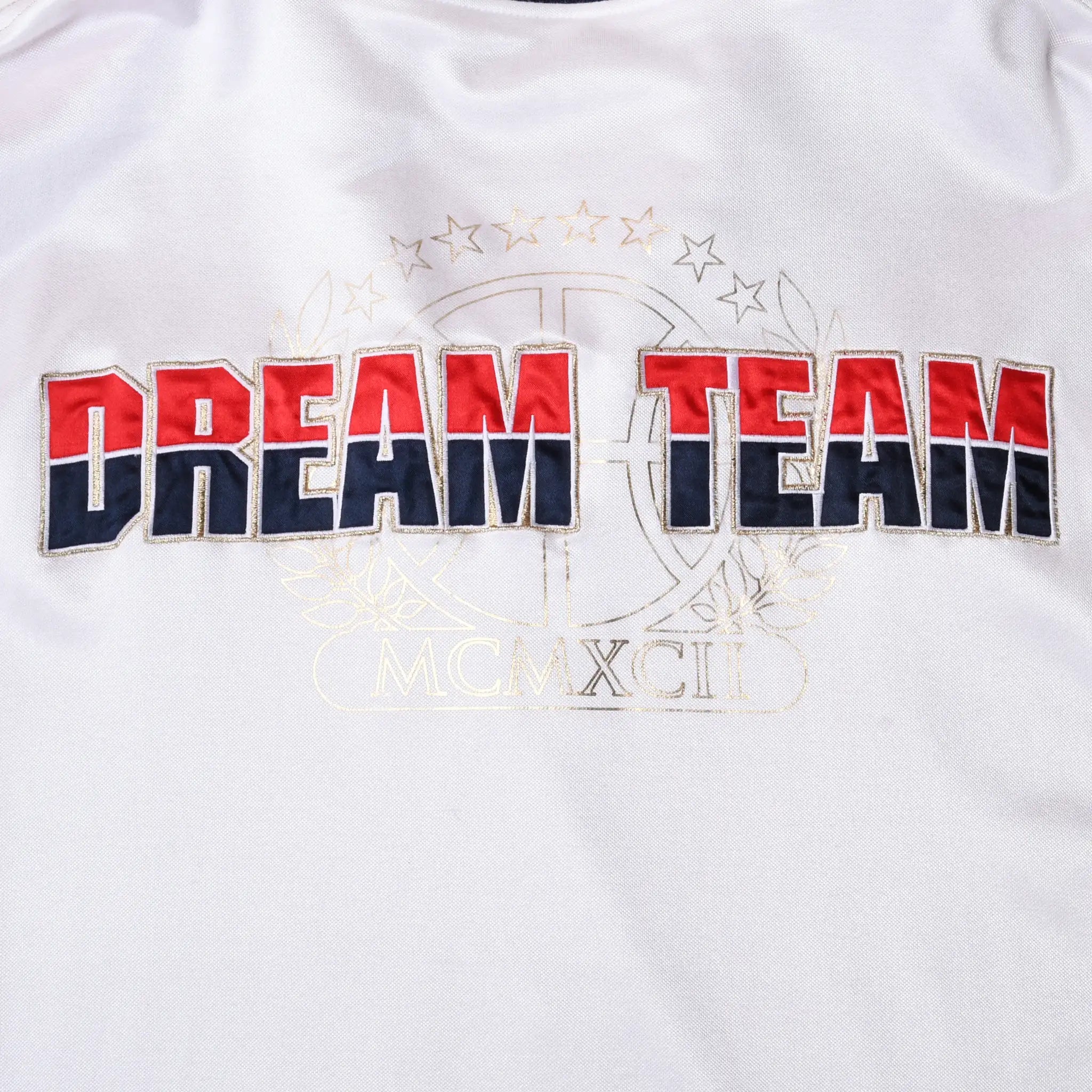 Close-up of red and navy Dream Team back embroidery with basketball and stars