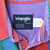 Close-up of Wrangler collar label marked 16 1/2-35, preshrunk, and X-long tails