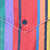 Close-up of snap-button chest pocket and multicolor striped fabric