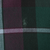 Close-up of tonal Ralph Lauren pony embroidery on dark green and burgundy plaid fabric