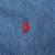 Close-up of red Polo pony embroidery on blue denim jacket chest