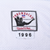 Close-up of Mitchell & Ness Throwbacks NFL hem label with 1996 year tab