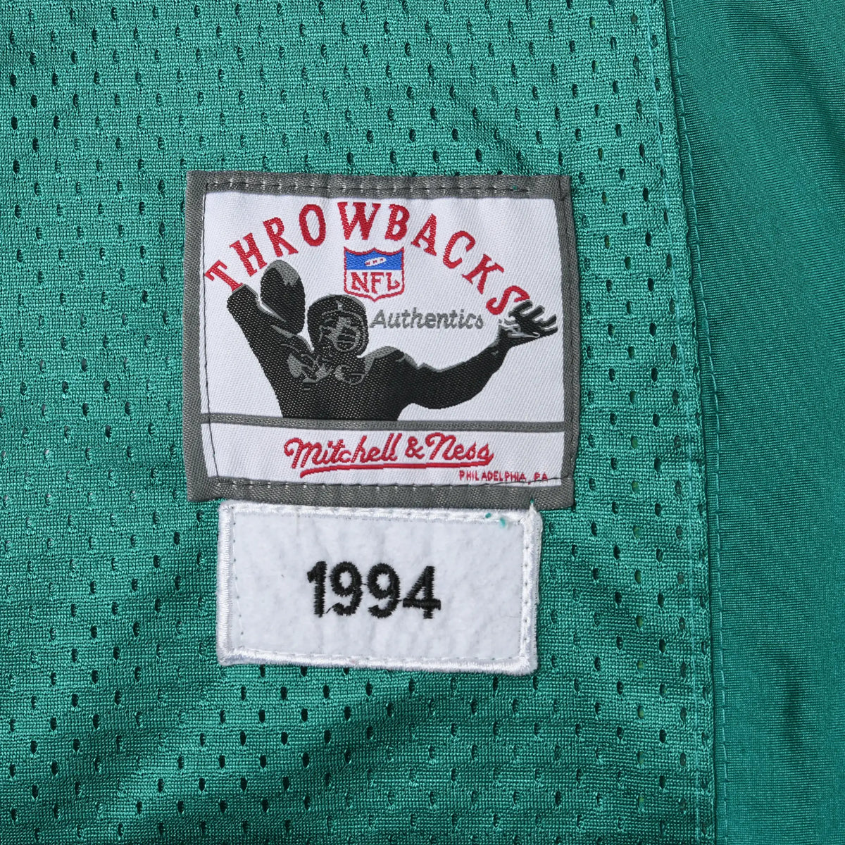 Close-up of Mitchell & Ness NFL Throwbacks jock tag with 1994 patch