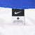 Close-up of black Nike neck label marked size large inside the white jersey