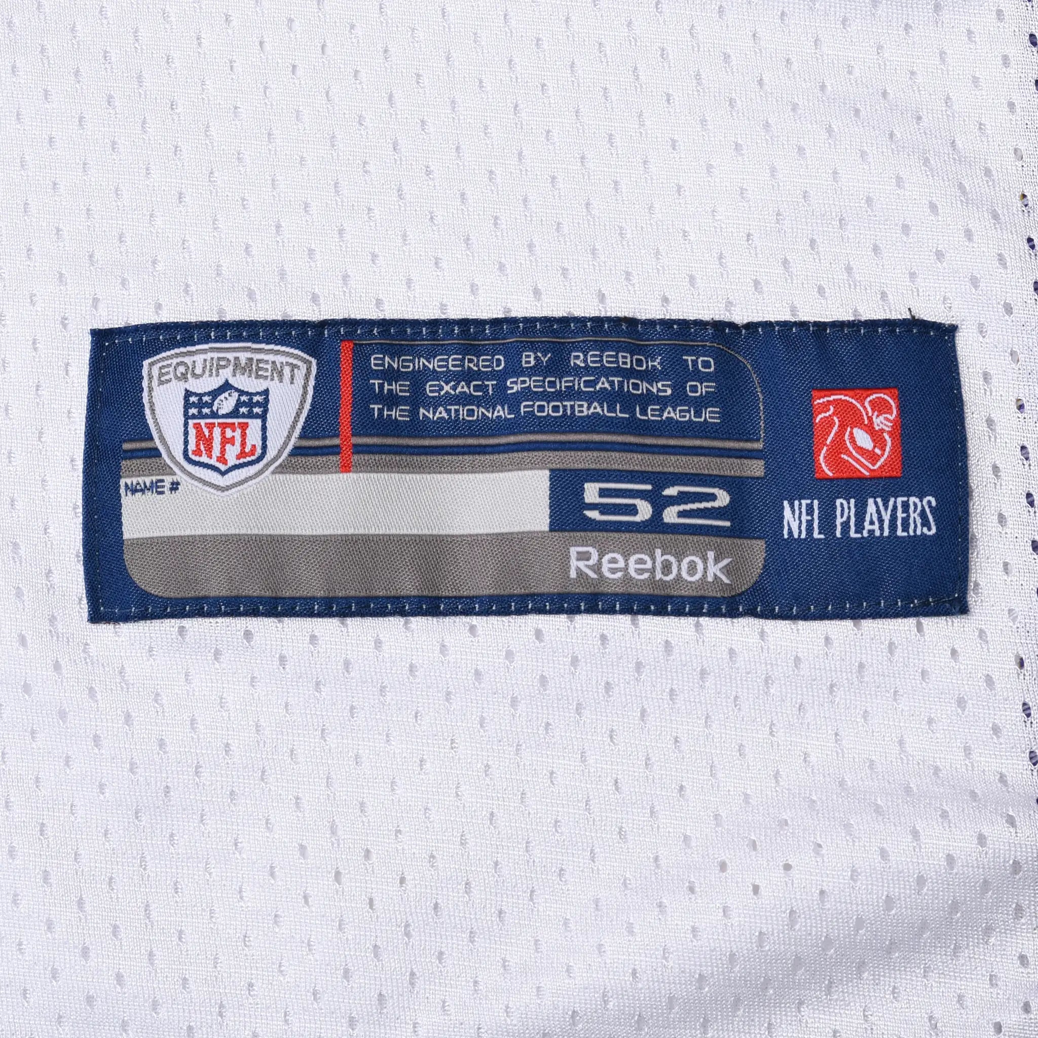 Close-up of Reebok NFL Equipment size 52 jock tag on white jersey fabric