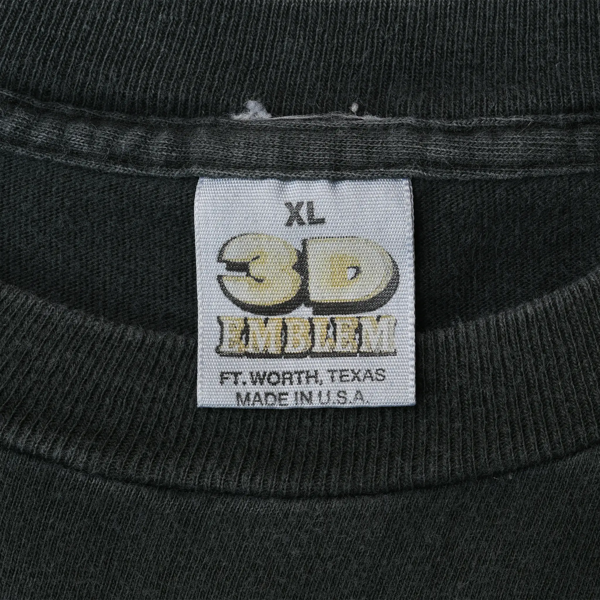 Close-up of XL 3D Emblem Fort Worth, Texas, Made in USA neck tag