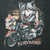 Close-up of Harley-Davidson Survivors graphic with wolf and red motorcycle