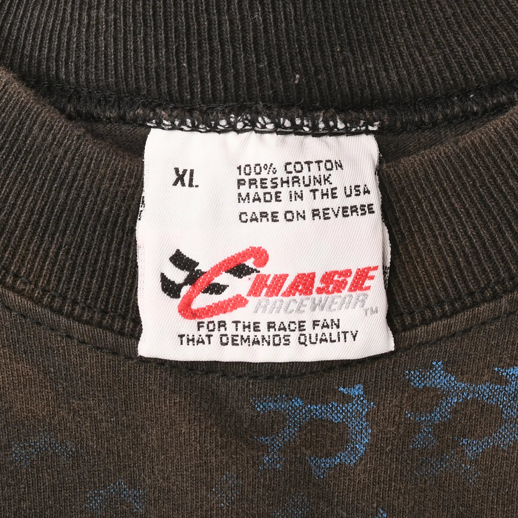 Close-up of Chase Authentics XL neck label stating 100% cotton and made in the USA