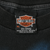 Harley-Davidson neck tag showing size XL, 100% cotton, and Made in USA
