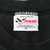 Close-up of Chase Authentics XL neck label marked Made in the USA inside black tee