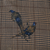 Close-up of two blue and brown pheasants printed on brown plaid fabric