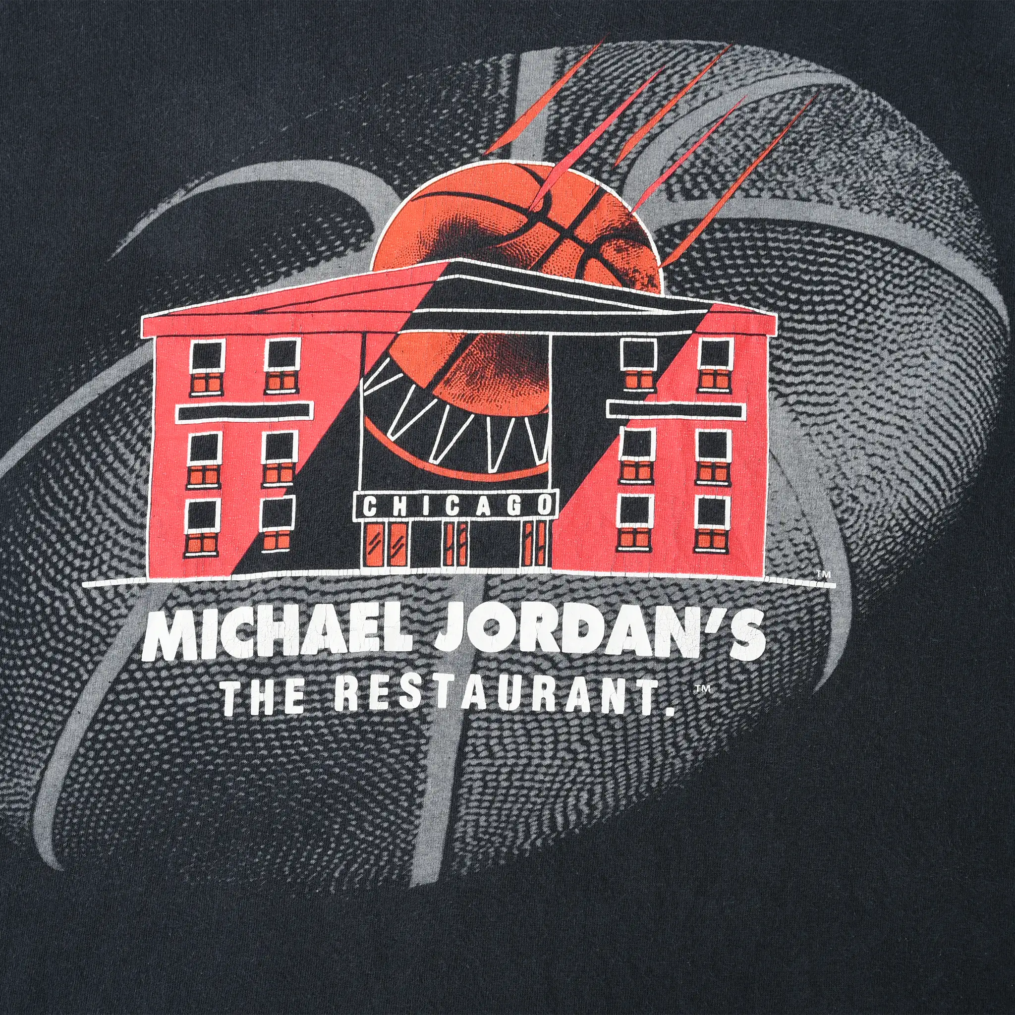 Close-up of Michael Jordan's The Restaurant Chicago print with basketball and building