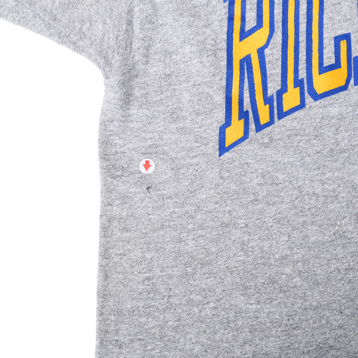 Close-up of small flaw marked by an arrow near the Richland front graphic
