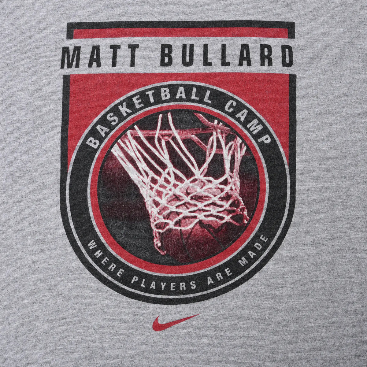 Close-up of Matt Bullard Basketball Camp hoop graphic in red, black and white with Nike Swoosh