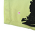 Close-up of lower hem with arrow marker pointing to a small spot beside the black print
