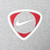 Close-up of red and white Nike Swoosh shield graphic on grey fabric