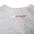 Close-up of white and red Nike Soccer print below the back collar
