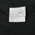 Nike XL neck tag inside black T-shirt, marked Made in Honduras
