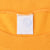Close-up of faded white neck tag and ribbed collar on gold T-shirt