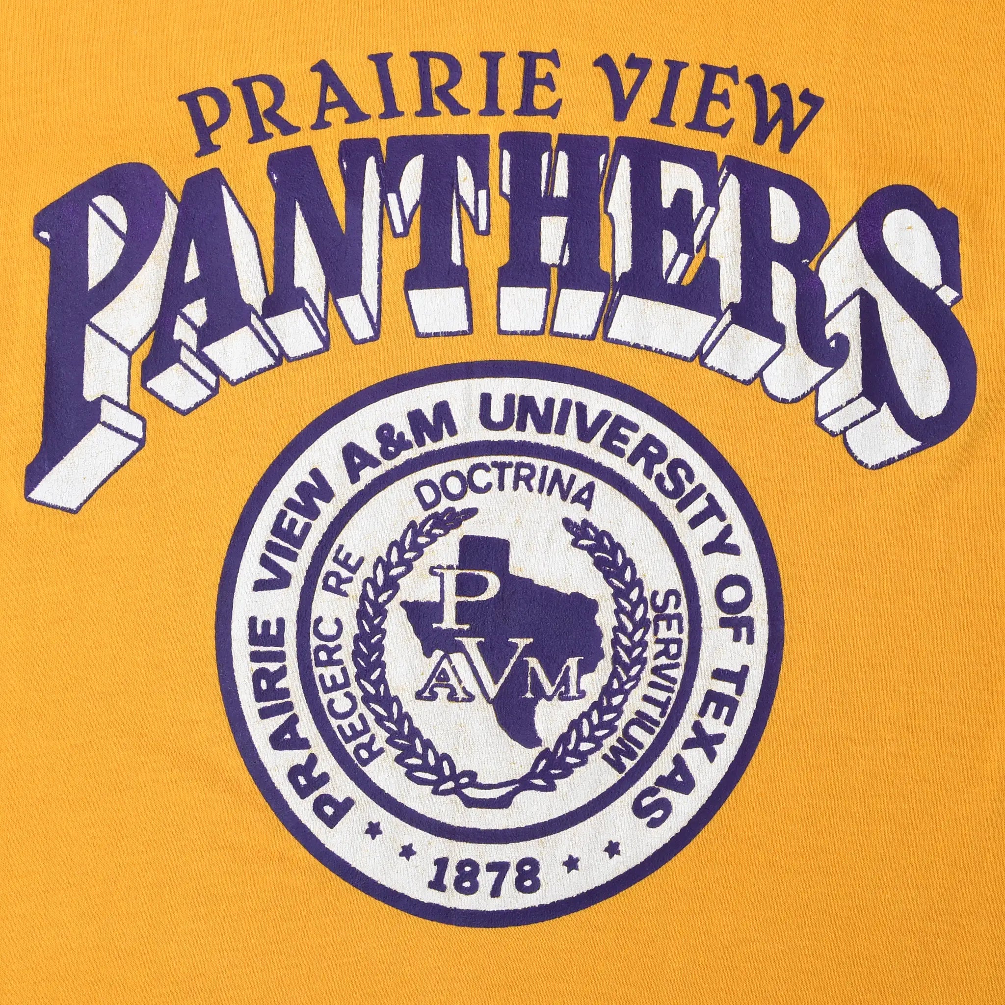Close-up of purple and white Prairie View Panthers lettering and university seal print