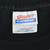 Close-up of Hanes Heavyweight neck label inside black T-shirt