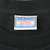 Close-up of Anvil Sport Maxweight neck tag marked preshrunk, 100% cotton, and XL (42)