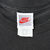 Close-up of Nike neck labels showing Made in USA and size XL