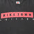 Close-up of red, black, and white Nike Town Chicago chest print