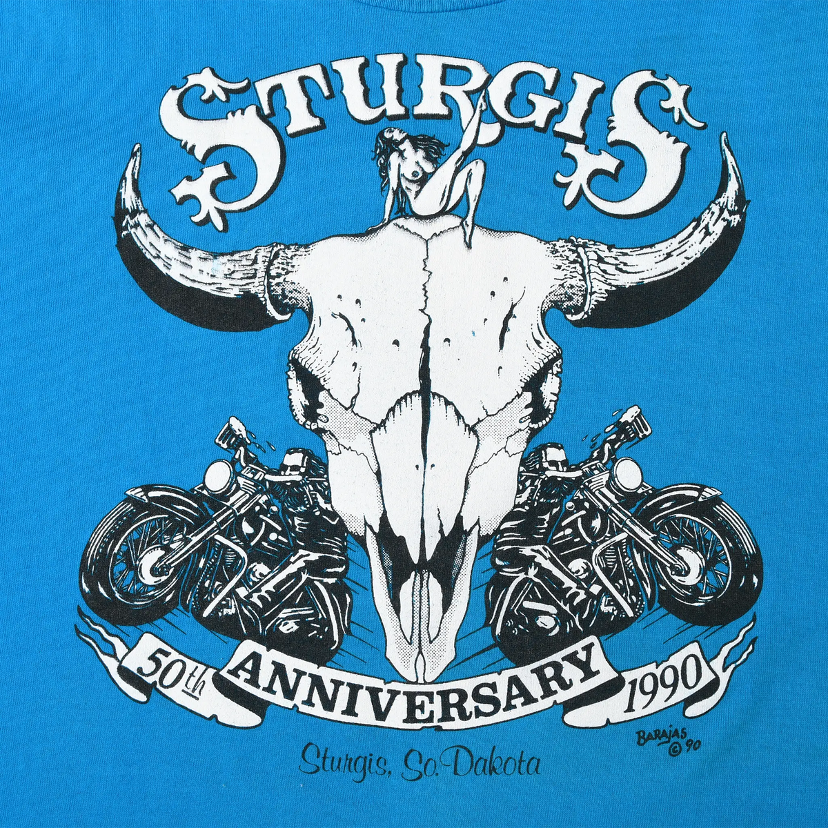 Sturgis 50th Anniversary 1990 graphic with steer skull and motorcycles on blue fabric