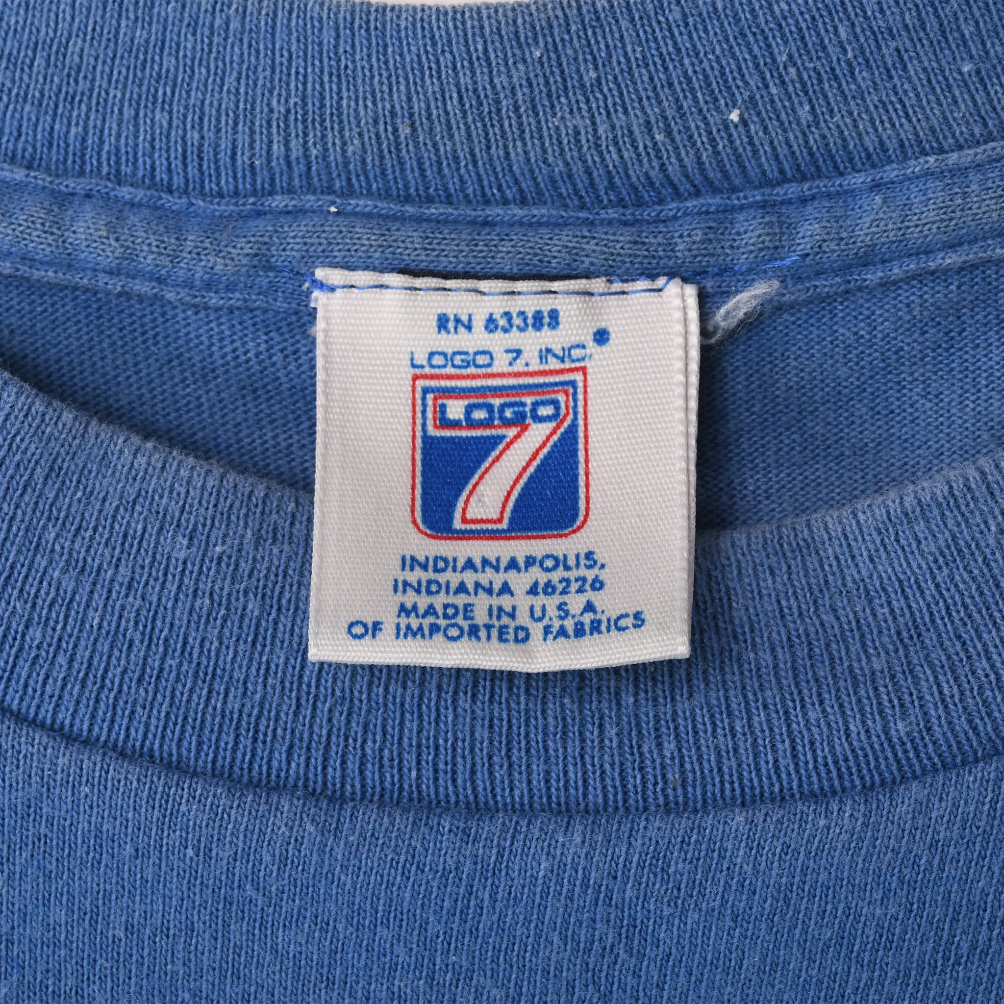 Close-up of Logo 7 neck tag inside blue Seattle Seahawks T-shirt