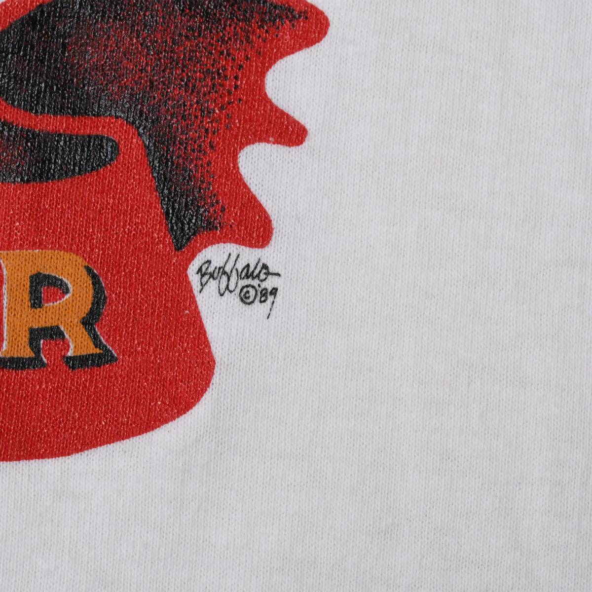 Close-up of Buffalo '89 artist signature beside the front print