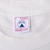 Close-up of Delta large neck tag reading 100% cotton, preshrunk and fabric made in USA