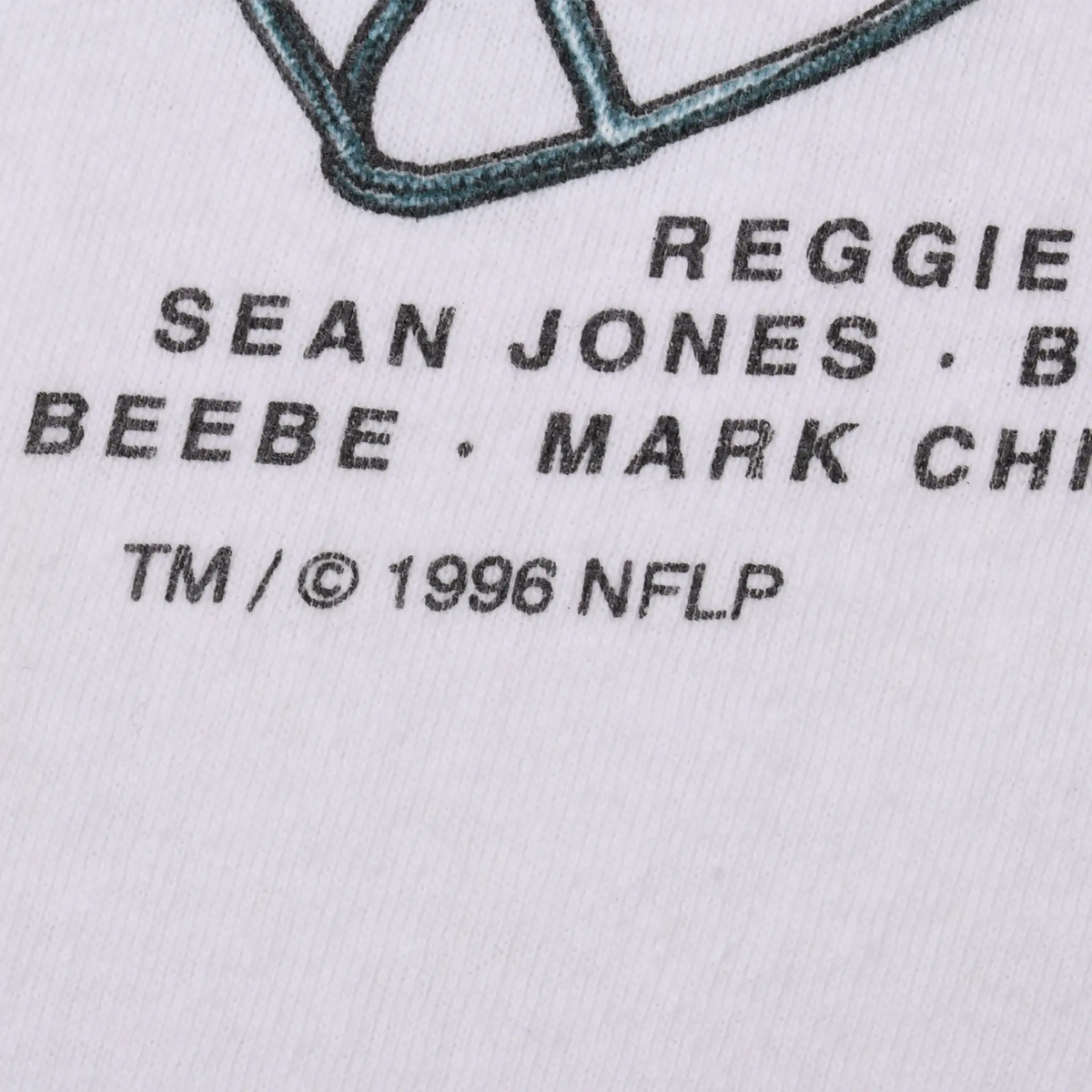 Close-up of player names and TM/© 1996 NFLP text printed on the shirt