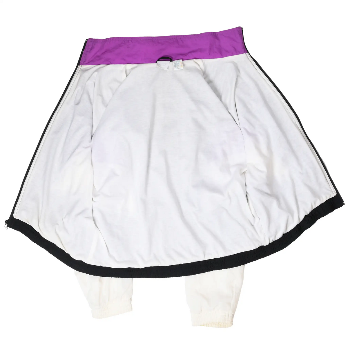 Inside view of unzipped Nike windbreaker showing white lining and purple inner collar