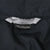 Close-up of Nike neck label and Made in Philippines tag inside black windbreaker jacket
