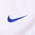 Close-up of blue Nike Swoosh embroidery on the white front panel
